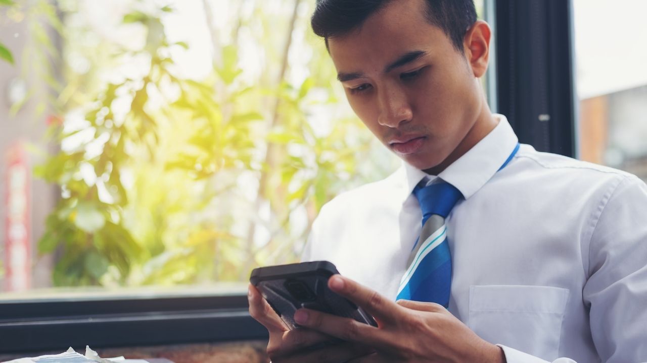man checking smartphone